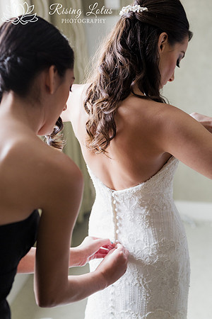 Love this moment of the bride getting into her dress for the first time.